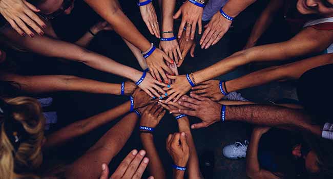 group team Through crisis we can find a common humanity